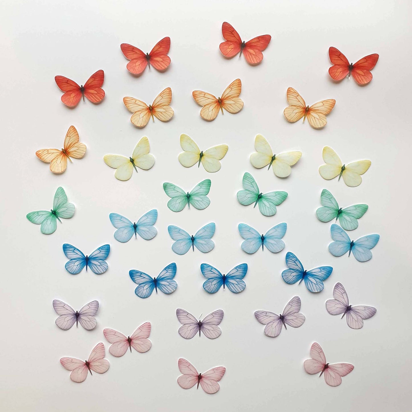 These wafer butterflies are simply magnificent and will make ordinary desserts extraordinary.  The pack contains 32 wafer butterflies in mixed colours, as shown in the photos.  These butterflies are precut and ready to use. Each butterfly has a wingspan of approximately 1.5 inches (4cm).